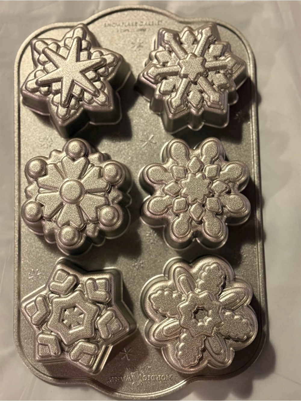 Nordic Ware Frozen Snowflake Cakelet Pan - 6 Cavity Cast Aluminum (Made in USA)